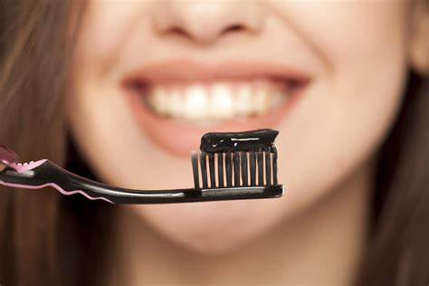 Brush with activated charcoal toothpaste